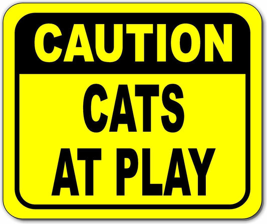 Caution cats at play Bright yellow metal outdoor sign